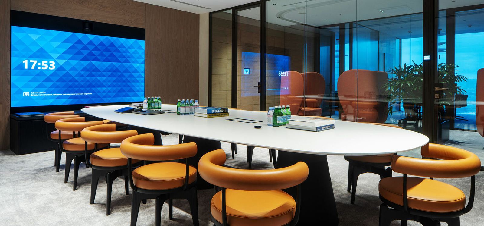 Oval boardroom with large-format display, MR Group Office